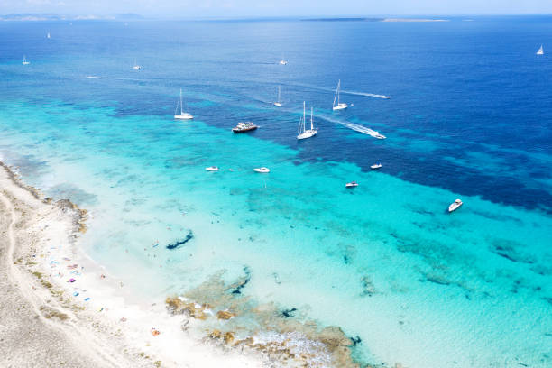 People sunbathing in Illetes, Formentera - Spain