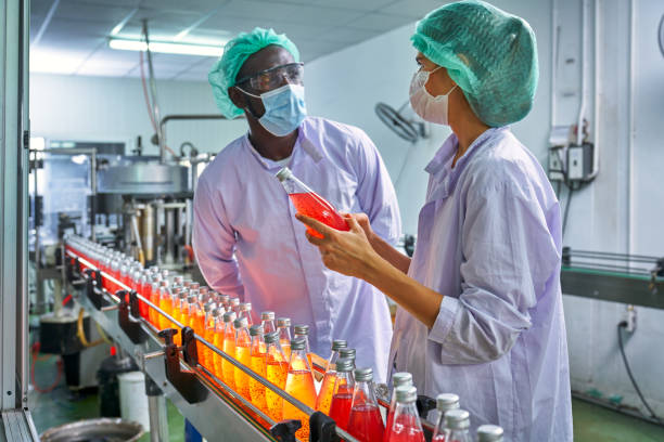 istock African and Caucasian Lab Specialist are discussing with quality 1339604480