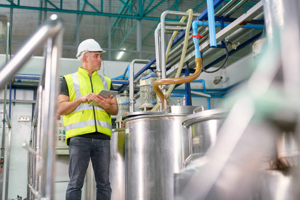 istock Caucasian Engineer check performance of automatic machine of bev 1339605834