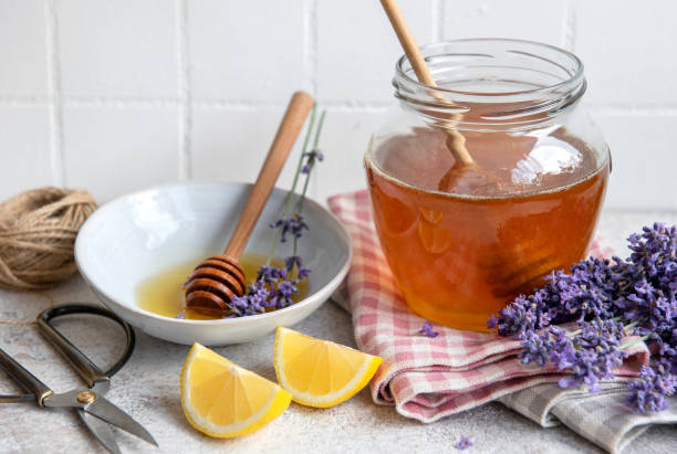 istock Jar with honey and fresh lavender flowers 1339607205