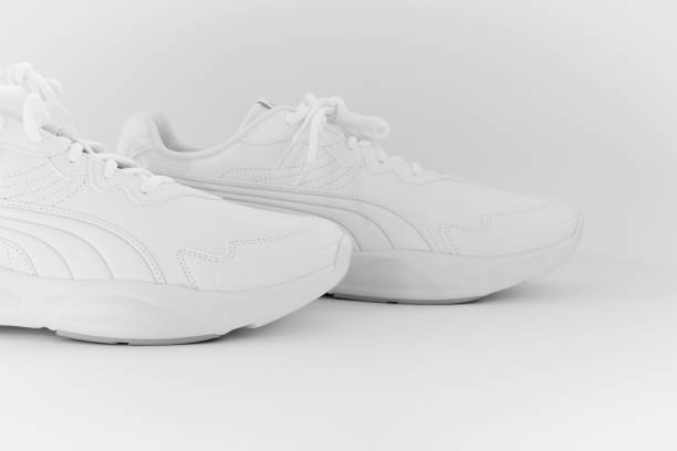 istock white sneakers with laces on a white background. isolate. side view 1339607269
