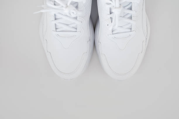 istock white sneakers with laces on a white background. isolate. top view. 1339607312