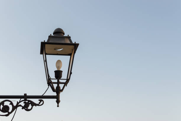 istock Old lamp with blue sky in the background 1339609009