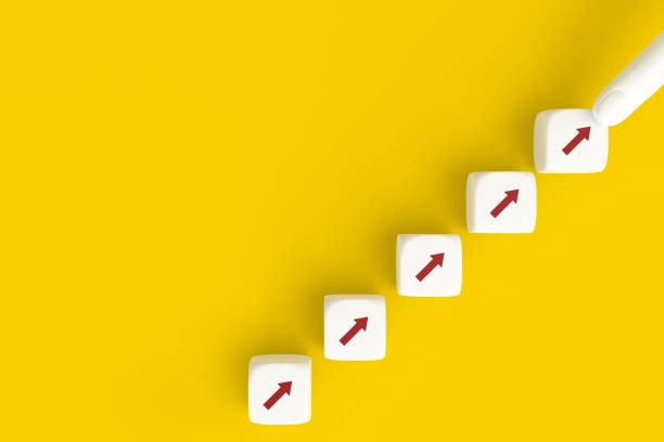 istock Business concept growth success process, Arranging cube stacking as step stair on yellow background, copy space. 1339613433