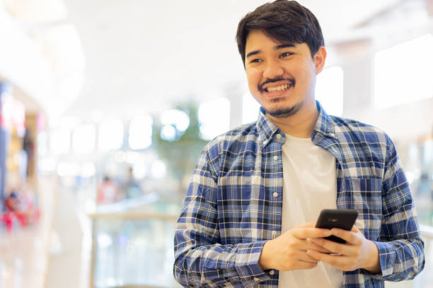 istock close up candid shot on young attractive middle eastern man looking while smile with happy feeling in department shopping mall for modern and lifestyle concept 1339615007
