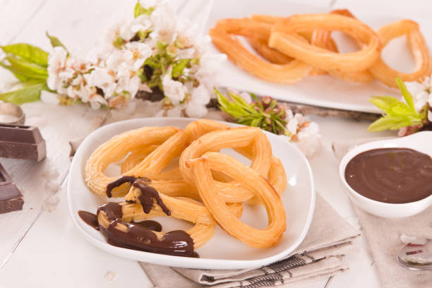 istock Churros with chocolate dipping sauce. 1339615347