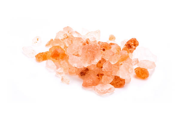 istock Pink Himalayan salt with stacking focusing isolated on white background 1339617474