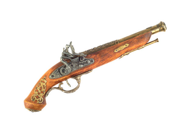 istock Old antique firearm with bronze inlay isolated on white background. 1339617627