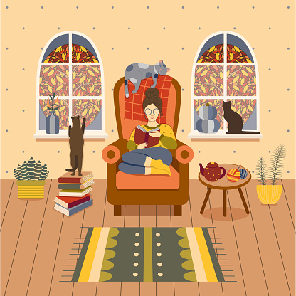 Cozy autumn at home. Girl sitting in armchair with book and reading in homely atmosphere with cats, houseplants, teapot and knitting. Woman with her kitties. Hygge fall at home concept illustration.