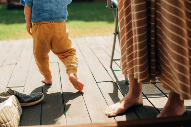 istock Little child walking on veranda with mother 1339619475