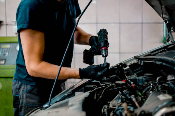 istock Auto mechanic working on car engine in mechanics garage 1339626199