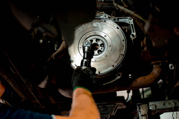 istock Auto mechanic working on car engine in mechanics garage 1339626645