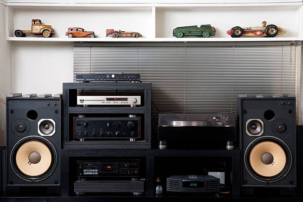 Hi-Fi sound system with vintage tin toy car The room of the hobby, Hi-Fi sound system with vintage tin toy car.  stereo photos stock pictures, royalty-free photos & images