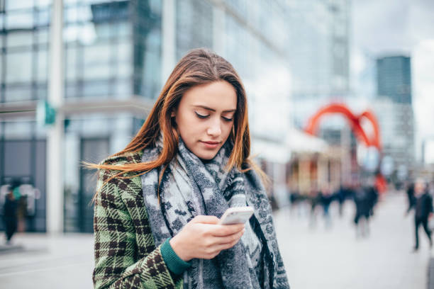 istock Beautiful woman in Paris texting 1339627992