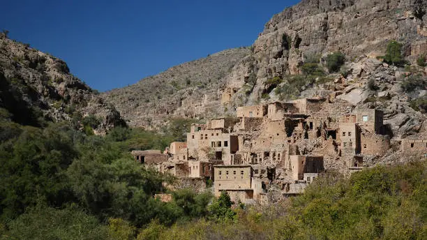 An uninhabited village is found in the Wadi Bani Habib gorges, in the mountains of the Jabal Shams group in the interior of Oman near Nizwa