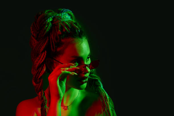 istock young woman with dreadlocks in red sunglasses 1339629389