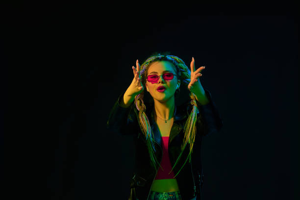 istock young woman with dreadlocks in red sunglasses dancing 1339629573