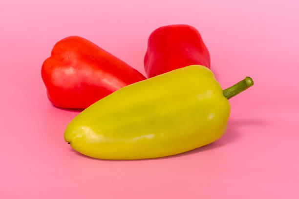 istock fresh paprika red and green on pink background 1339631110