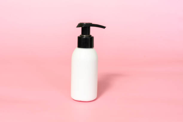 istock bottle for cream with dispenser on pink background 1339631127