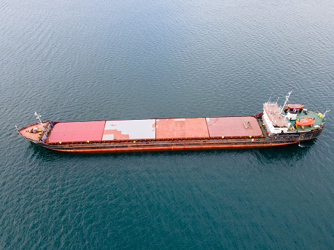 Aerial view of dry bulk carriers cargo ship in the sea while transporting wheat and corn
