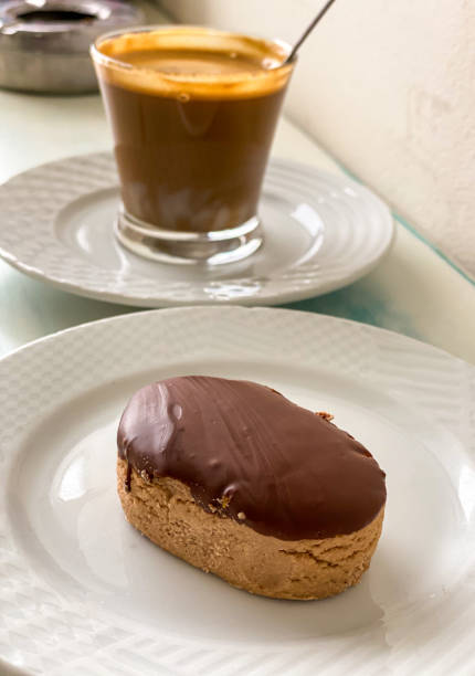 istock Breakfast of cup coffee served with spanish biscuits, polvorones, mantecados and chocolate dessert. 1339634564