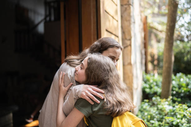 istock Mother welcoming daughter at home 1339635184