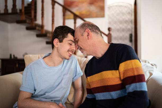 istock Father head against head with son at home 1339635202