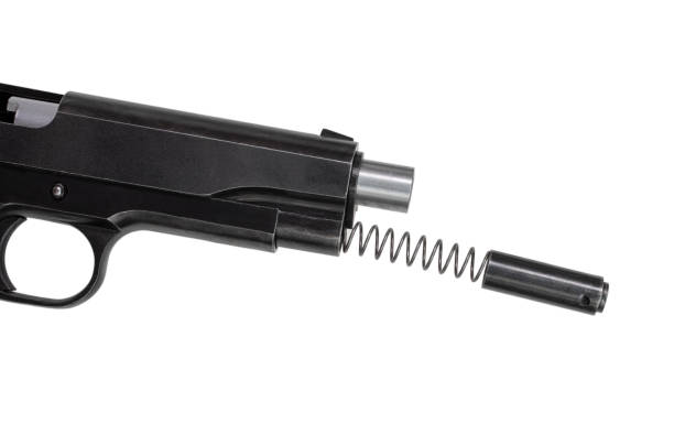 istock Semi auto pistol with spring and plunger being taken out 1339635911