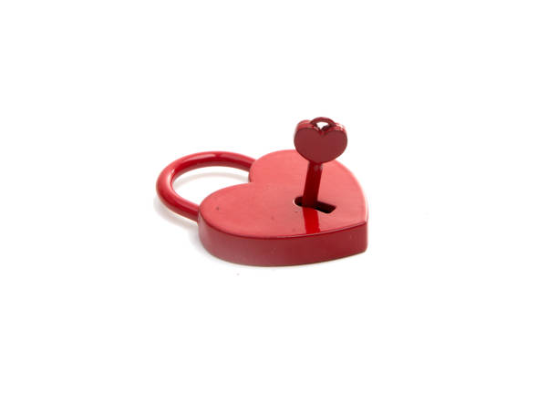 istock metalic red heart with a key on the white 1339646085