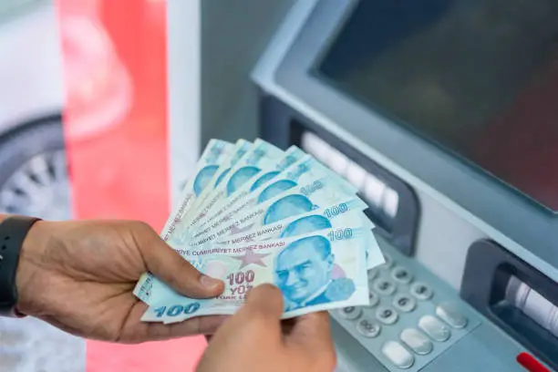 Photo of Man Withdraw  Cash Money At ATM.Cash Dispenser And Money Stock Photo