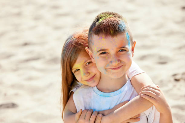 istock child girl and boy smeared with colored powder 1339652596