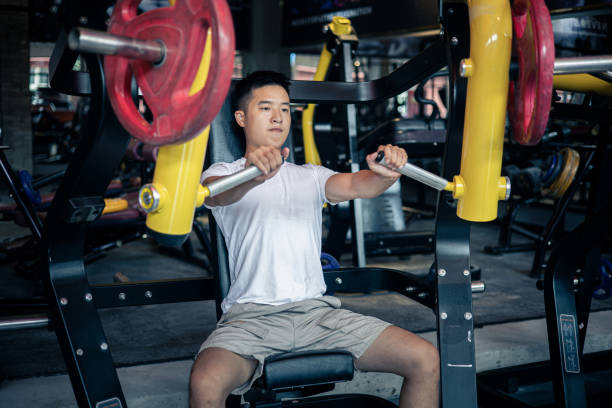 istock Man doing chest exercises in a gym 1339653493