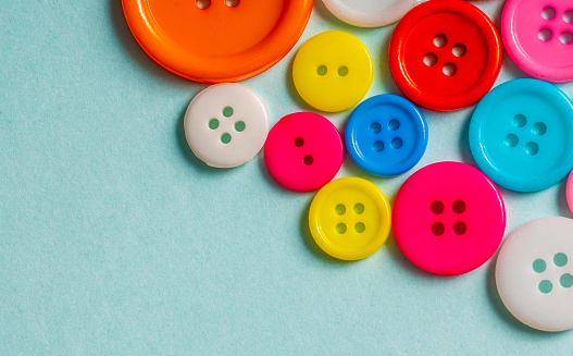 Colorful plastic buttons isolated on white background