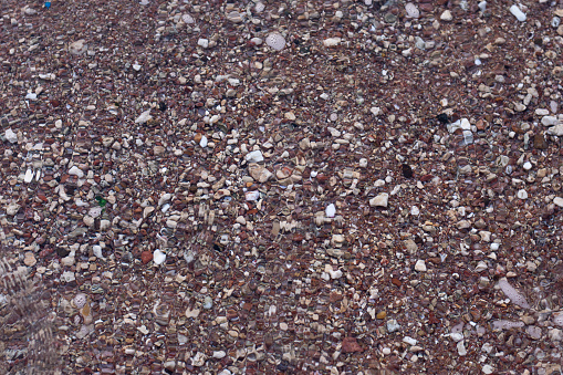 background texture pebbles stones in sea water. Sea pebbles.