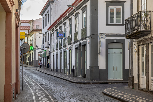 Typical Portuguese street with cobblestones in the center of the Azorean city Ponta Delgada