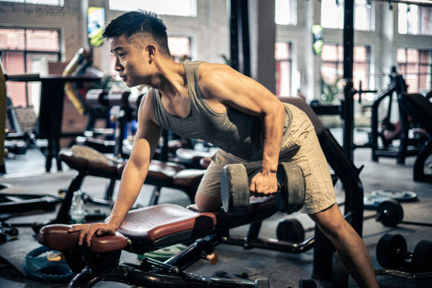 istock Man exercising in the gym 1339659953