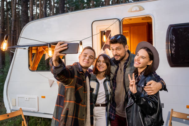 istock Young man making selfie with friends by mobile house 1339665980