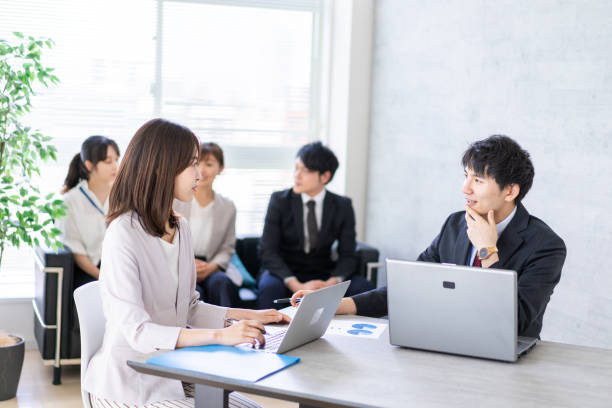 istock Young office worker having an business meeting 1339667053