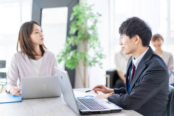 istock Young office worker having an business meeting 1339667073