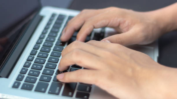 istock close up hand typing on a laptop 1339670647