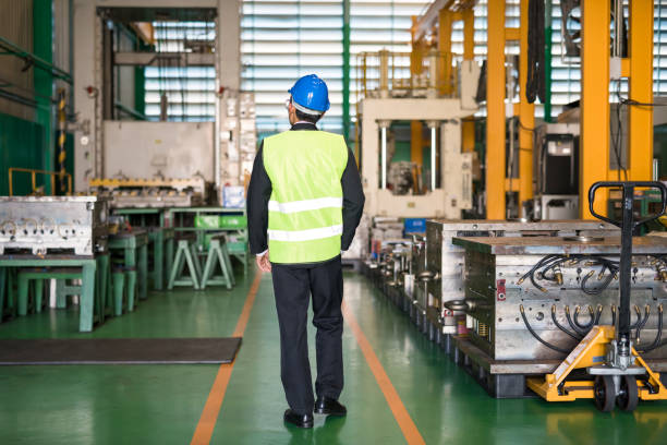 istock Factory manager walk to check production warehouse 1339675351