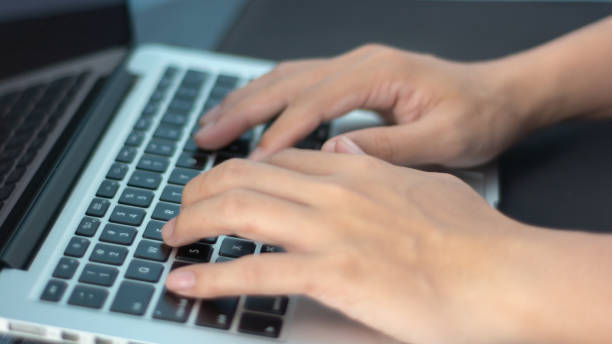 istock close up hand typing on a laptop 1339676199