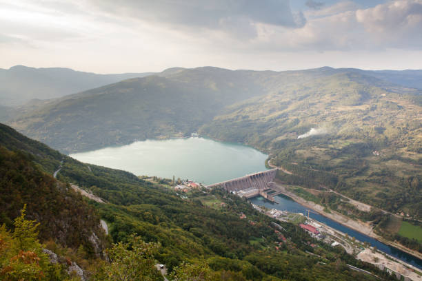 istock Dam power plant, lake on river 1339679593