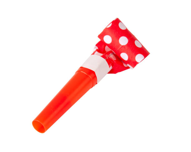 istock Rolled festive noisemaker or party whistle horn on the white 1339679642
