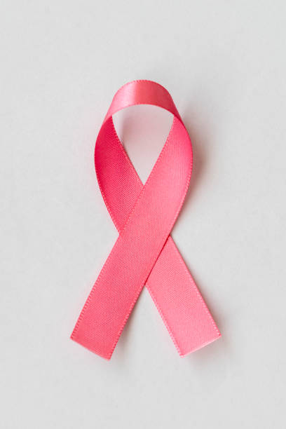 fiocco rosa della campagna di prevenzione del cancro al seno. rosa ottobre - aids awareness ribbon ribbon bow cut out foto e immagini stock