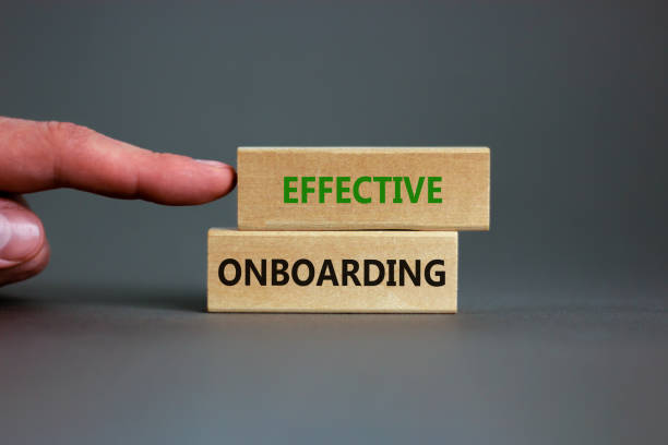 istock Effective onboarding symbol. Wooden blocks with words Effective onboarding on beautiful grey background. Businessman hand. Business, HR and effective onboarding concept. Copy space. 1339682230