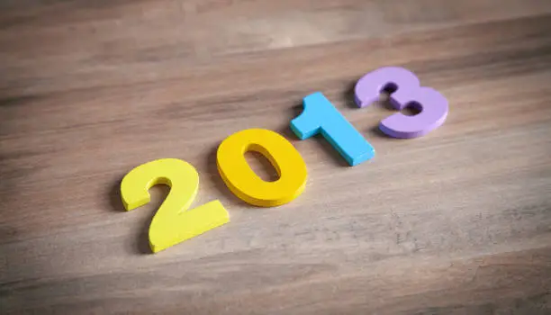 Photo of Happy New Year. 2013 on wooden background