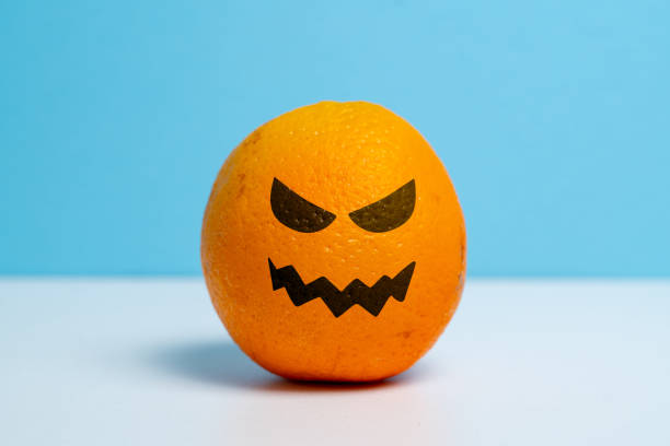 istock Ripe orange with a wicked smile. Halloween holiday. 1339687767