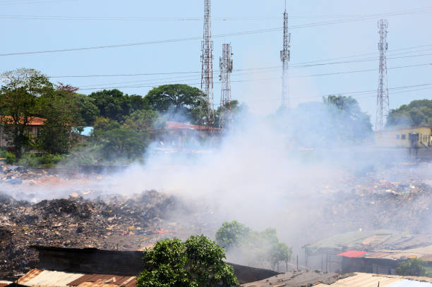 Dark smoke from forest fires cause pollution on the air in the rural scene