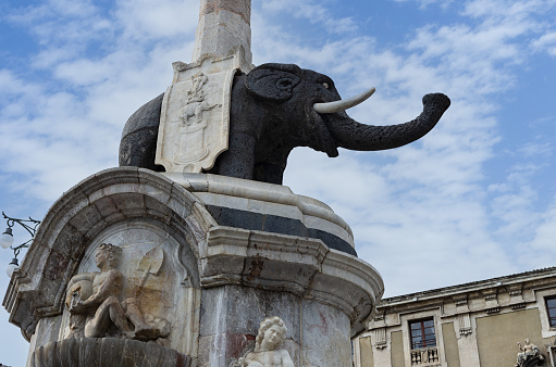 Catania, Italy - September 7, 2013: this image shows the Fontana dell'Elefante, a landmark of the City of Catania. The elephant is carved out of lava rock.